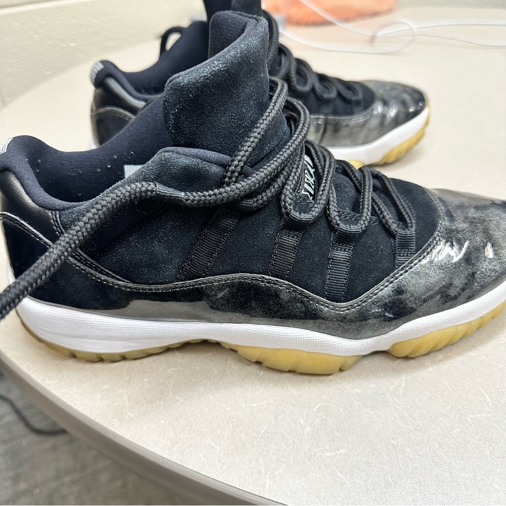 Jordan 11 Black and White Sneakers with Gold Accents - Picture 5 of 10
